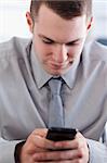 Close up of concentrated businessman writing a text message