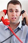 Close up businessman overextended with the telephone