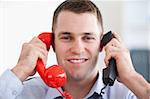Close up businessman handling the telephone stress smiling