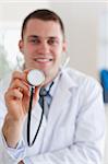 Smiling doctor ready to use his stethoscope