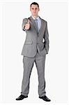 Businessman giving thump up on white background
