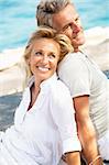 Close-up portrait of a happy romantic couple outdoors.