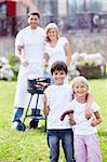 Happy family with children make barbecue