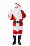 Santa Claus with a clock on a white background