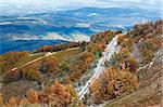 October Carpathian mountain plateau with first winter snow and autumn colorful foliage