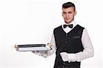 Young person in a suit holding an empty tray isolated on white background