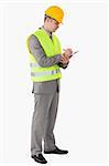 Portrait of a young contractor taking notes against a white background