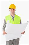 Portrait of a builder looking at a plan against a white background