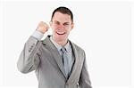 Businessman with his fist up against a white background