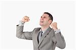 Businessman with his fists up against a white background