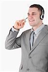 Portrait of a young operator using a headset against a white background