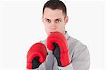 Businessman ready to fight against a white background