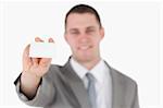 Businessman showing a blank business card against a white background