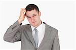 Anxious young businessman against a white background