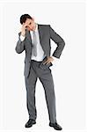 Tired businessman against a white background