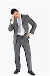 Businessman experiencing a setback against a white background