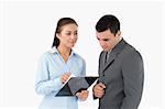 Businesswoman explaining data to her partner against a white background