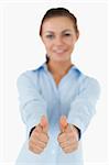 Businesswoman giving both thumbs up against a white background
