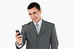 Businessman happy about text message against a white background