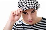 Handsome serious young man portrait in stylish striped dress and cap