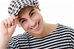 Handsome young man portrait in stylish striped dress and cap