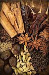 Image of Mixed Spices on a Wood Vertical Background