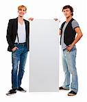 Two modern teenagers holding blank billboard. Isolated on white