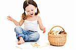 Cute little girl with ponytails playing. Isolated on white