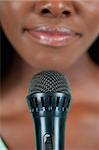 Close up of microphone being used by female singer