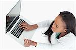 Woman booking a flight online against a white background