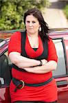 Young Woman Standing Next To Car