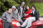 Gang Of Youths Sitting On Cars