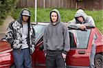 Group Of Young Men With Cars