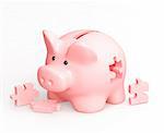 Piggy bank and puzzles. Isolated over white