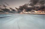 Morning at the beach with beautiful clouds