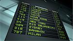 Flight information board in airport terminal. Extreme POV. DOF focus on board.