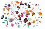 Rough precious and semi-precious stones - ruby, sapphire, emerald, tourmaline, opal, apatite, aquamarine, iolite, spinel. Isolated on white.