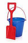 Beach bucket and spade in blue and red colours isolated over white background.