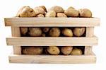 whole potatoes in wooden box