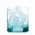 Empty glass with ice cubes isolated over white background