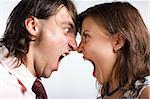 Aggression young men and woman on white background