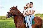 Family with daughter on a horse