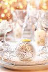Place setting for Christmas in white and golden tone