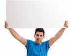 Portrait of a young man showing an empty billboard on white background