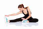 Beautiful fitness woman doing stretching exercise on white