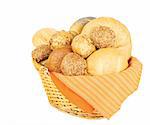 Assortment of baked bread in a basket on white background