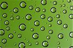 Abstract macro of water drops over green background