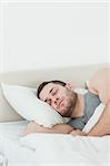 Portrait of a handsome man sleeping in his bedroom