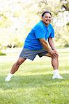 Senior Man Exercising In Park