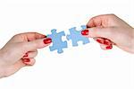 partnership concept. two hands with different pieces of puzzle